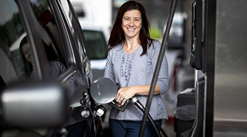 Woman Filling Gas Tank